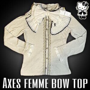 brand new axes femme bow top it has pearls lace, and frills